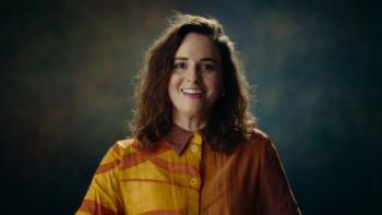 Untold Raygun: Breaking Badly movie: Rachael Gunn sits for her interview in a yellow-orange shirt