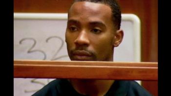 Untold: Shooting Guards movie: Ex-NBA player Javaris Crittendon in dark green jumpsuit center in court awaiting sentencing