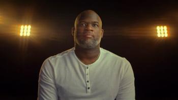 Untold: The Testimony of Vince Young movie: Vince Young sits in a dark room with four spotlights