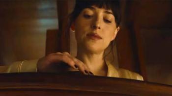Verity movie: Dakota Johnson gently touches a wooden headboard with a focused expression