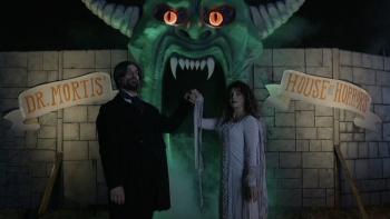 V/H/S/Halloween Movie: A costumed couple invite patrons into their "home haunt"; the door is a giant green monster mouth