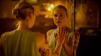 Vicious: Dakota Fanning talks to herself in the mirror.