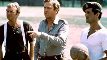 Victory: Bobby Moore, Michael Caine, and Sylvester Stallone stand with soccer ball