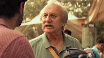 Vijay 69 movie: Older Indian man with white hair and mustache center speaks outdoors with Indian man with brown hair left