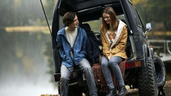 Viking Wolf: Thale and Jonas sit on the back of a Jeep. 