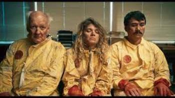 Villains Incorporated Movie: Three people in yellow lab suits sit, looking dirty and dejected