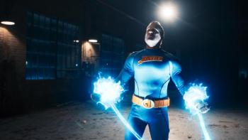 Villains Incorporated Movie: Superhero looks strong while his hands are blue-powered blasts