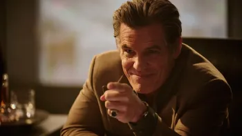 The Running Man: Josh Brolin grinning and pointing his finger toward the camera