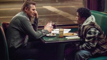 A Walk Among the Tombstones: Older man and young person sitting across from each other at table with food and drinks.