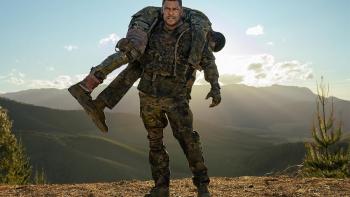 War Machine: Alan Ritchson carries a body.