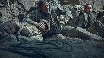 War Machine: Rangers hide by a cliff.