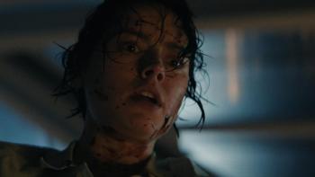 We Bury the Dead movie: Daisy Ridley, with blood splatter on her face, looks shocked and scared