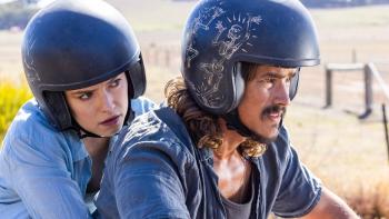 We Bury the Dead movie: Daisy Ridley holds onto Brandon Thwaites as he drives a motorcycle