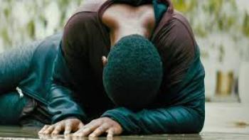 Weathering: A woman lies on the ground