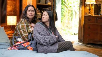 The Wedding Banquet movie: Lee and Angela sit together on a bed; Lee looks upset