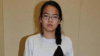 What Jennifer Did movie: Asian American woman in white shirt, long black hair, and glasses stares solemnly ahead 