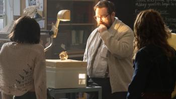 Whistle Movie: Dr. Craven (Nick Frost) studies the whistle under the light of an overhead projector while students look on