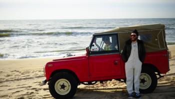 Who Invited Charlie? Movie: On the beach, Charlie stands outside a Jeep while Max sits inside