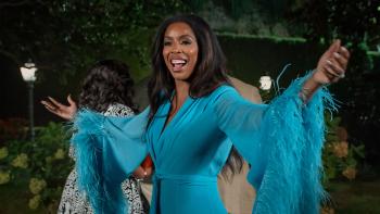Why Did I Get Married Again?: Tasha Smith in a blue dress.