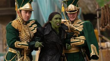 Wicked: For Good movie: Elphaba is restrained by two green-clad guards