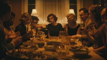 Wildcat Movie: Flannery O'Connor (Maya Hawke) sits at the table at a dinner party