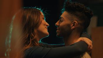 Wish You Were Here movie: Isabelle Fuhrman and Mena Massoud embrace and are about to kiss