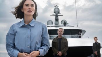 The Woman in Cabin 10: Keira Knightley stands on the front of a luxury boat looking concerned with Guy Pearce standing behind her