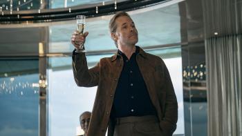 The Woman in Cabin 10: Guy Pearce raises a glass of champagne in a toast
