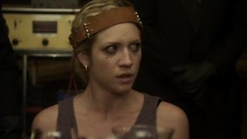 Would You Rather: Woman with headband looks worried in dimly-lit room