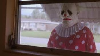 Wrinkles the Clown Movie: Sad-looking clown looks in window
