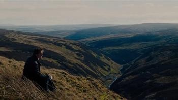 Wuthering Heights movie: Heathcliff (Jacob Elordi) sits on the cliffs of the Yorkshire moors