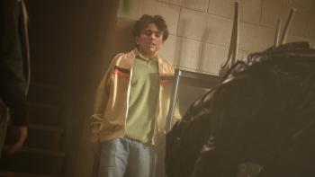 Xeno movie: Trae Romano is backed up against the wall in fear of a giant alien creature