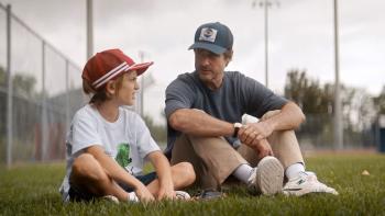 You Gotta Believe Movie: A father and son sit on a baseball field and talk