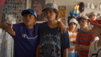 You Gotta Believe Movie: Two Little League teammates stand together, the rest of the team behind them