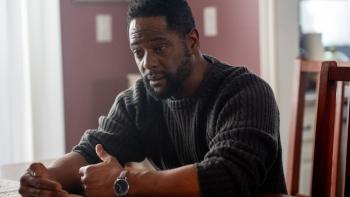 Youngblood movie: Blair Underwood sits at a kitchen table