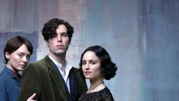 The Laureate: A young White man stares at the camera with a woman either side of him