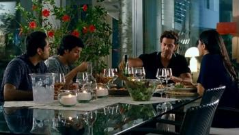 Zindagi Na Milegi Dobara: Three men and a woman enjoying dinner together.