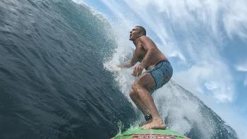 100 Foot Wave TV show screenshot 3: McNamara surfs a big wave