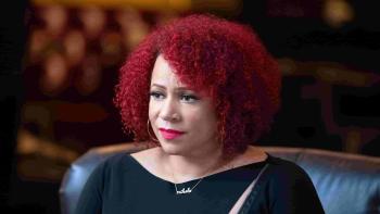 The 1619 Project TV show: Mid-shot of Nikole Hannah-Jones as she interviews someone.