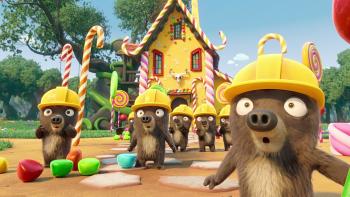 7 Bears TV show screenshot: 6 animated brown bears wear yellow hardhats and stand in front of a candy-covered house