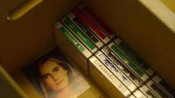 900 Days Without Anabel TV show screenshot: A picture of a young white woman's face is in a cardboard box