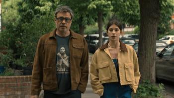 Alice and Steve TV show screenshot 2: Steve and Izzy walk along a city street; they appear to be having a serious discussion but are dressed casually