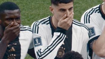 All or Nothing: The German National Team in Qatar screenshot 3: Teammates cover their mouths in protest when posing for picture on field.. 