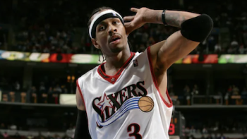 Allen Iv3rson screenshot 1: Younger Allen Iverson holds hand up to ear during game.