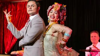 Alternatino with Arturo Castro TV Series: Arturo is dressed as a 1950s-style bandleader with a dancer with a Carmen Miranda-like costume