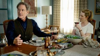 American Classic TV show screenshot 1: Kevin Kline and Laura Linney sit at a dinner table.