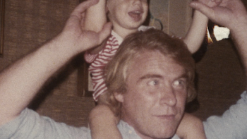 American Conspiracy: The Octopus Files TV show screenshot 3: Danny Casolaro holds baby on shoulders. 