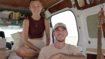 American Murder Gabby Petito TV show screenshot 2: Gabby Petito and Brian Laundrie sit in van smiling at camera.