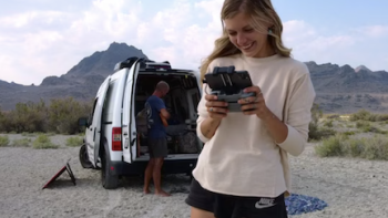 American Murder Gabby Petito TV show screenshot 3: Gabby Petito in white shirt working drone controls. 