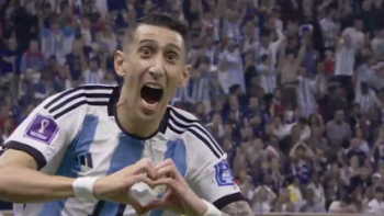 Angel di Maria screenshot 1: Angel di Maria makes heart shape and yells on football field. 